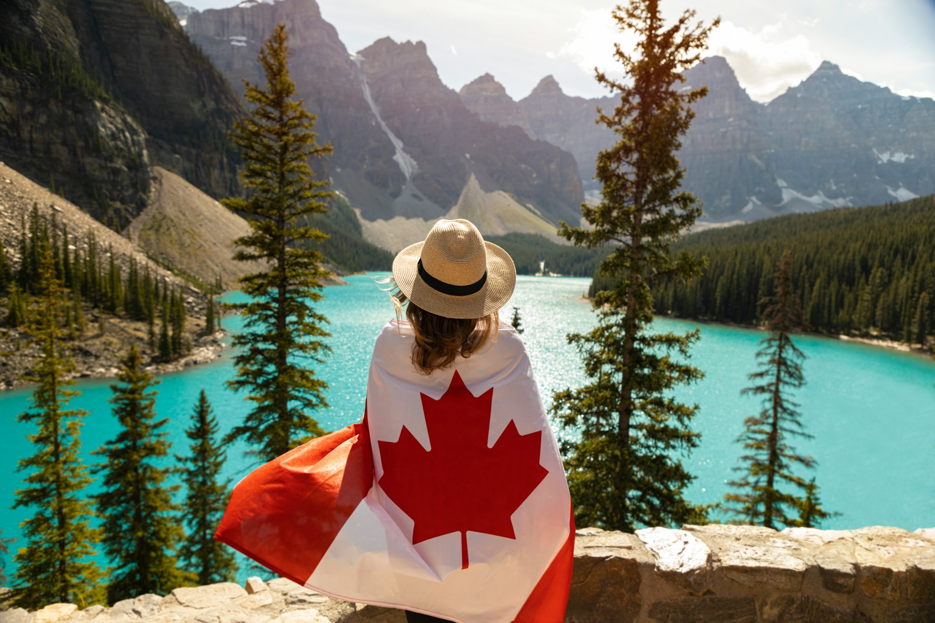 a woman with a canadian flag on her back